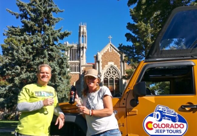 two guests with Colorado Jeep Tours enjoying wine tour outside Winery at Holy Cross Abbey
