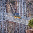 Colorado Jeep Tours riding yellow jeep over Royal Gorge Bridge