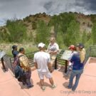 Tourists learning about rock formations from Colorado Jeep Tour guide