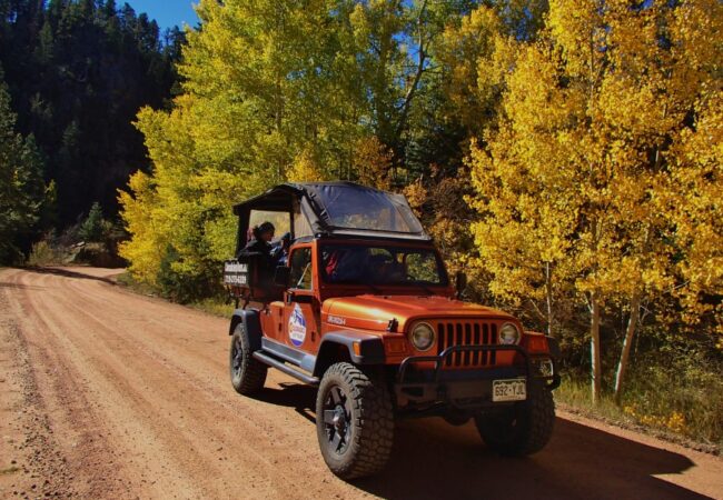 Fall Foliage Colorado Jeep Tour on dirt road with changing leaves in background