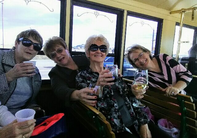 Ladies drinking wine on trolley