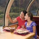 mom and daughter looking at scenery from dome car in train Colorado Jeep Tours